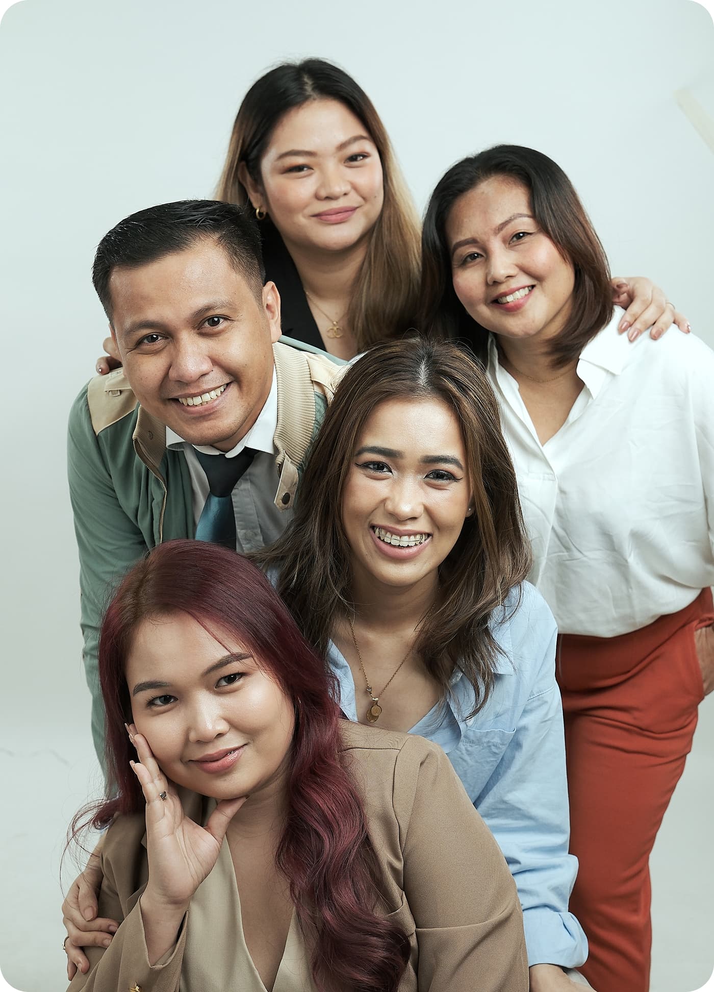 Five RemoteGenies freelancers smiling together